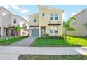 Modern two-story home with stylish facade, beautiful landscaping, and a two-car garage at 8982 Cabot Cliffs Dr, Davenport, FL 33896