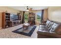 Inviting living room with natural light, tile floors, and comfortable seating at 929 Louvre Ct, Kissimmee, FL 34759