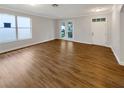 Large open living room boasting hardwood flooring, neutral paint, and natural light at 2679 Rainbow Springs Ln, Orlando, FL 32828