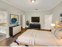 Spacious main bedroom featuring neutral decor, hardwood floors, and ample closet space at 2679 Rainbow Springs Ln, Orlando, FL 32828