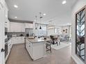 Open-concept kitchen with stainless steel appliances and dining area at 4409 Lions Gate Ave, Clermont, FL 34711