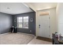 Bright living room with neutral walls, large window and carpeted floors at 4644 Bernard Blvd, Haines City, FL 33844