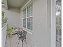 Cozy front porch with a small seating area, perfect for enjoying quiet moments outdoors at 5353 Red Leaf Ct, Oviedo, FL 32765