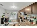 Modern kitchen boasting granite countertops, stainless steel appliances, and ample cabinet space at 601 Swallow Ct, Apopka, FL 32712