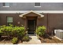 Front entrance with landscaping and a covered porch at 6566 S Goldenrod Rd # 82A, Orlando, FL 32822