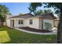 Charming single-story home with stone accents, landscaped garden, and a welcoming entrance at 10519 Wyndcliff Dr, Orlando, FL 32817