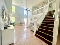 Inviting living room with a staircase and tile flooring at 1212 Bradwell Dr, Orlando, FL 32837