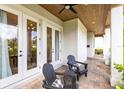 Inviting outdoor patio with brick flooring, ceiling fan and comfortable seating area at 1410 W New Hampshire St, Orlando, FL 32804