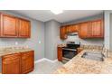 Modern kitchen with stainless steel appliances and granite countertops at 2078 Keyes Ln, Deltona, FL 32738