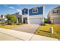 Charming two-story home with a two-car garage and brick paver driveway in a well-kept neighborhood at 2354 Emerald Springs Dr, Apopka, FL 32712