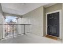 Inviting entryway with a black door and secure entry to the building at 3428 Soho # 301, Orlando, FL 32811