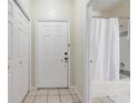 A tiled entry way to the property featuring a bathroom at 3428 Soho # 301, Orlando, FL 32811