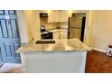 Cozy kitchen with granite countertops and stainless steel appliances at 4606 Commander Dr # 1126, Orlando, FL 32822