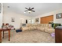 Spacious living room showcasing neutral carpet, ceiling fan, and large sectional sofa at 468 E Oakwood Ave, Orange City, FL 32763