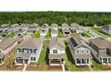 Aerial view of a residential neighborhood featuring well-maintained homes and landscaped yards at 6449 Sprucepine Ln, St Cloud, FL 34771