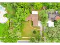 Gorgeous aerial view of the home showcasing the landscaping, driveway and proximity to other properties at 1102 Winter Springs Blvd, Winter Springs, FL 32708