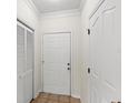 Inviting entryway features neutral tones and tile flooring, creating a clean and welcoming space at 12843 Madison Pointe # 208, Orlando, FL 32821