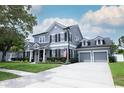 Beautiful home features a three car garage, well manicured lawn, and attractive landscaping at 14252 Anastasia Ln, Orlando, FL 32828