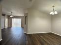 Large living room featuring stylish flooring and neutral walls at 1433 Bluff Loop, Dundee, FL 33838
