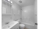 This is a bright bathroom with a tub-shower combo and a vanity sink with a square mirror at 1877 Courtland Blvd, Deltona, FL 32738