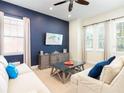 Inviting living area featuring a comfortable seating arrangement and stylish decor at 3004 Latitude Ln, Kissimmee, FL 34747