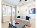 Cozy living room with plush seating, bright windows, and an open layout at 3004 Latitude Ln, Kissimmee, FL 34747