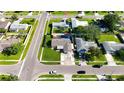 Bird's eye view of home, landscaped yard, and neighborhood streets with manicured lawns and mature trees at 4026 Seabridge Dr, Orlando, FL 32839