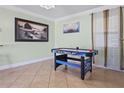 Fun game room featuring an air hockey table and decorative wall art, creating a perfect entertainment space at 4026 Seabridge Dr, Orlando, FL 32839