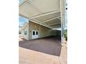 Spacious brick paved carport with ample parking space is attached to the house at 1115 Deer Creek Blvd, Davenport, FL 33837