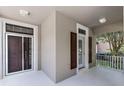 Inviting front porch with double doors and a glimpse of the well-maintained yard at 11837 Cave Run Ave, Windermere, FL 34786