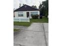 Charming home with traditional design, features a driveway at 1425 26Th St, Orlando, FL 32805