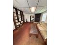 Living room with old carpet, fireplace and bookshelf at 1425 26Th St, Orlando, FL 32805