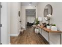 Elegant entryway featuring wood floors and a stylish console table at 15716 Sweet Lemon Way, Winter Garden, FL 34787