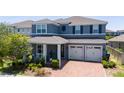Inviting two-story home with a cozy front porch and a two-car garage at 15716 Sweet Lemon Way, Winter Garden, FL 34787