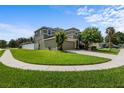 Desirable two-story home with a brick driveway, green lawn, and a two-car garage, nestled in a friendly neighborhood at 2850 Spring Heather Pl, Oviedo, FL 32766