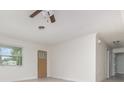 Bright living room featuring neutral walls and tile floors at 323 Scotland Dr, Daytona Beach, FL 32117
