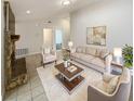 Cozy living room featuring neutral decor, a stone fireplace, and a plush rug for ultimate comfort at 412 Ranch Trl, Casselberry, FL 32707