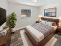 Comfortable bedroom with modern furnishings and a view of the screened pool at 412 Ranch Trl, Casselberry, FL 32707