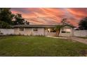 Charming single-story home featuring a well-maintained lawn, tidy landscaping, and a light beige exterior paint at 5300 Locksley Ave, Orlando, FL 32810