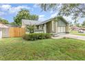 Beautiful single-Gathering home boasting a well-manicured lawn and a welcoming facade at 5308 Pinebury Ct, Orlando, FL 32808