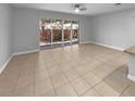 Bright living space with a sliding glass door offering views of the backyard at 576 Prospect Pt, Oviedo, FL 32765