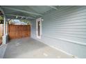A covered carport provides sheltered parking and side entry to the home at 716 N Rockingham Ave, Tavares, FL 32778