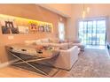 Cozy living room with modern decor and a view of the outdoor space at 7478 Brooklyn Dr, Kissimmee, FL 34747