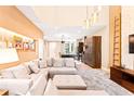 Bright living room with high ceilings, modern lighting, and a comfortable sectional sofa at 7478 Brooklyn Dr, Kissimmee, FL 34747