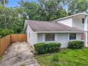 An aerial view of a quaint single-story home featuring well-maintained landscaping, and a concrete driveway at 809 Sugar House Blvd, Port Orange, FL 32129