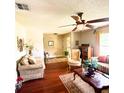 Inviting living room featuring hardwood floors and a cozy seating arrangement at 1025 Sullivan St, Deltona, FL 32725