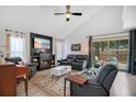 Comfortable living room with a fireplace, plush seating, and a view of the outdoor patio at 1061 Providence Ln, Oviedo, FL 32765