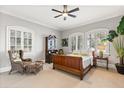 Cozy bedroom with natural light, a comfortable bed, classic furniture, and neutral decor at 1351 N Classic Ct, Longwood, FL 32779