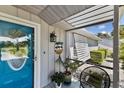 Charming front porch entrance showcases a welcoming atmosphere, enhanced by decor and a comfortable seating area at 2356 Date Palm Dr, Edgewater, FL 32141