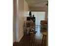 Hallway features lovely laminated wood floor, a ceiling fan, and access to the living areas at 2932 Silver Ridge Dr, Orlando, FL 32818